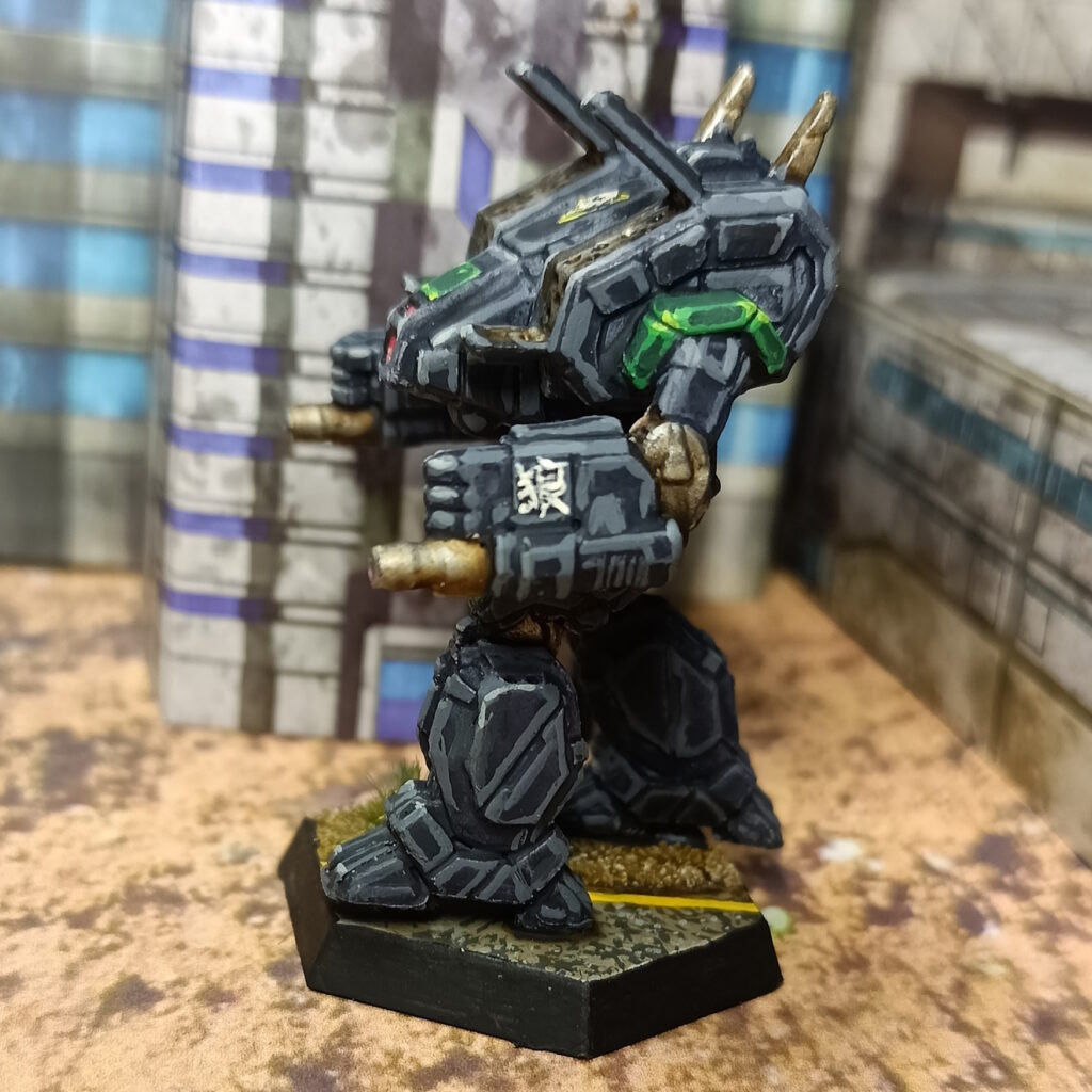 an Archer miniature painted in black with green accents