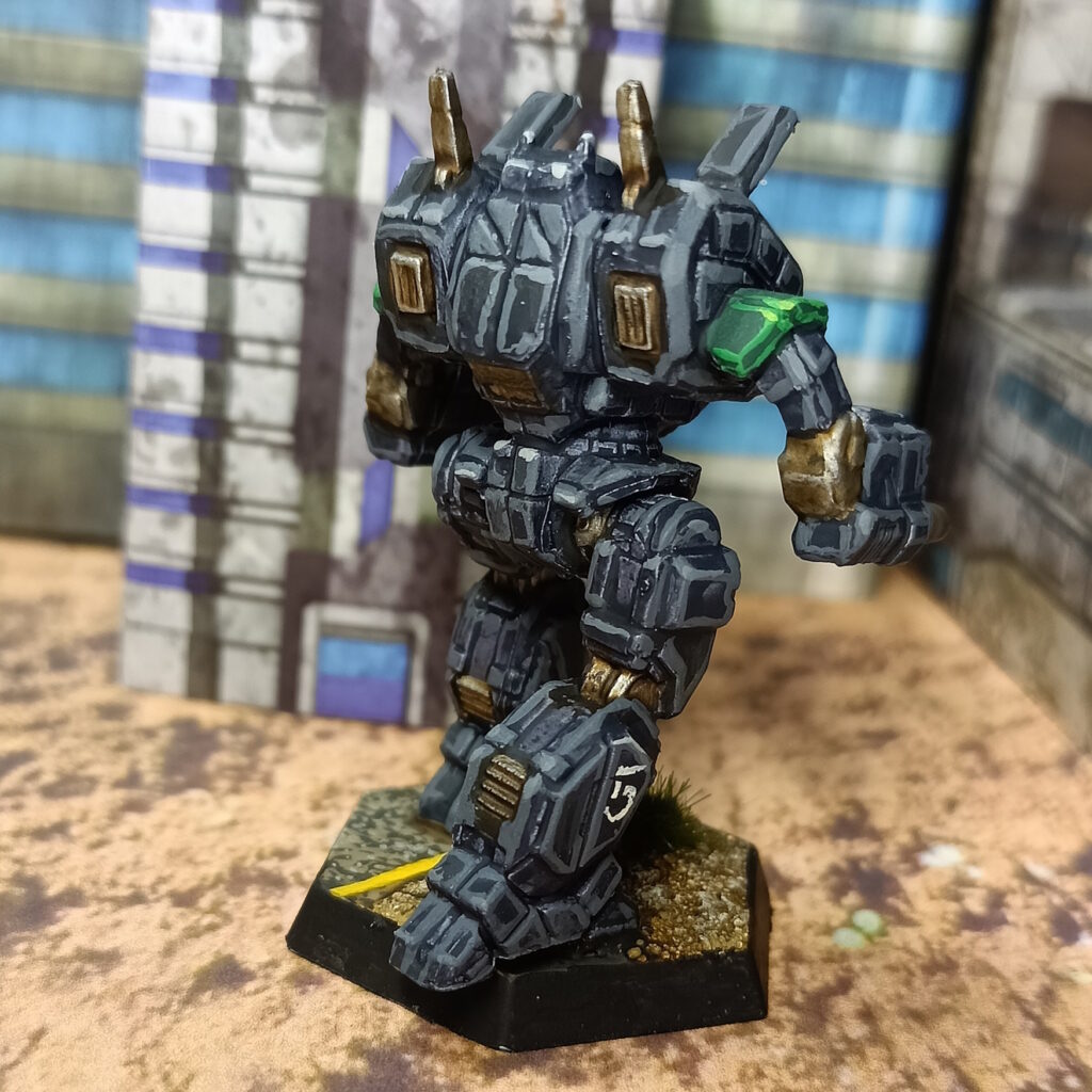 an Archer miniature painted in black with green accents