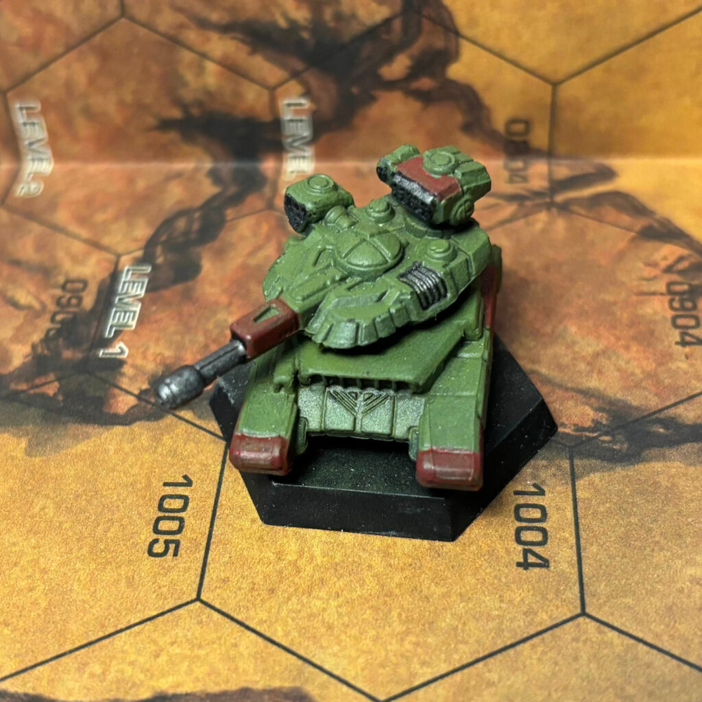 Manticore tank painted in olive drab with red highlights