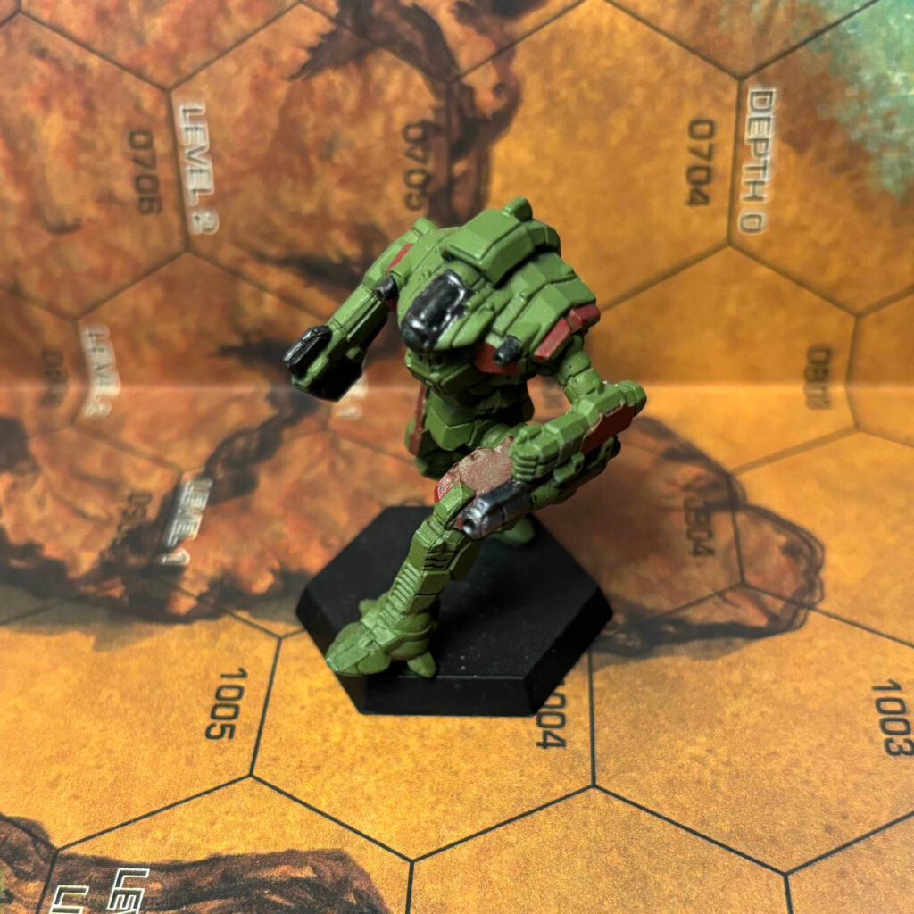 Nightsky miniature painted olive green with dark red highlights