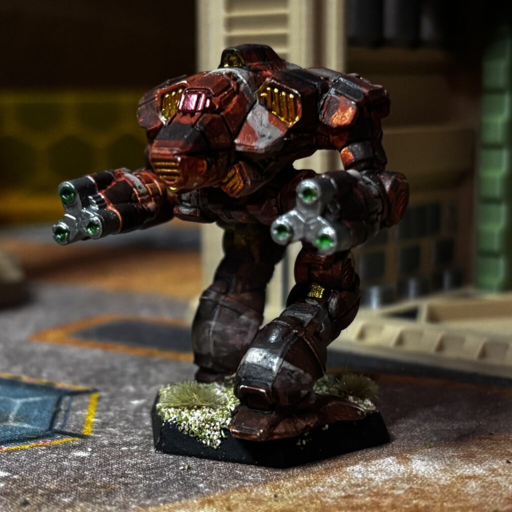 Supernova miniature in red-brown, black, and grey camouflage