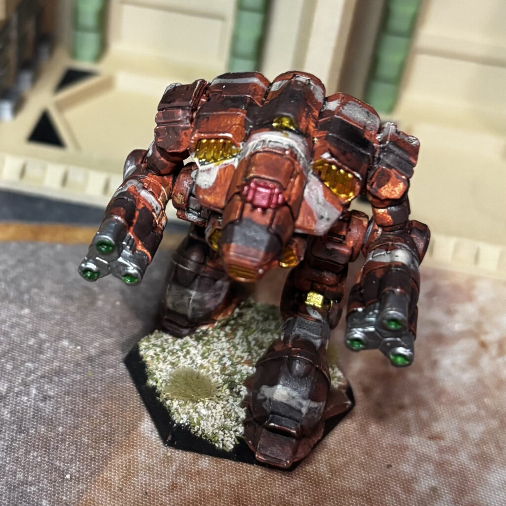 Supernova miniature in red-brown, black, and grey camouflage