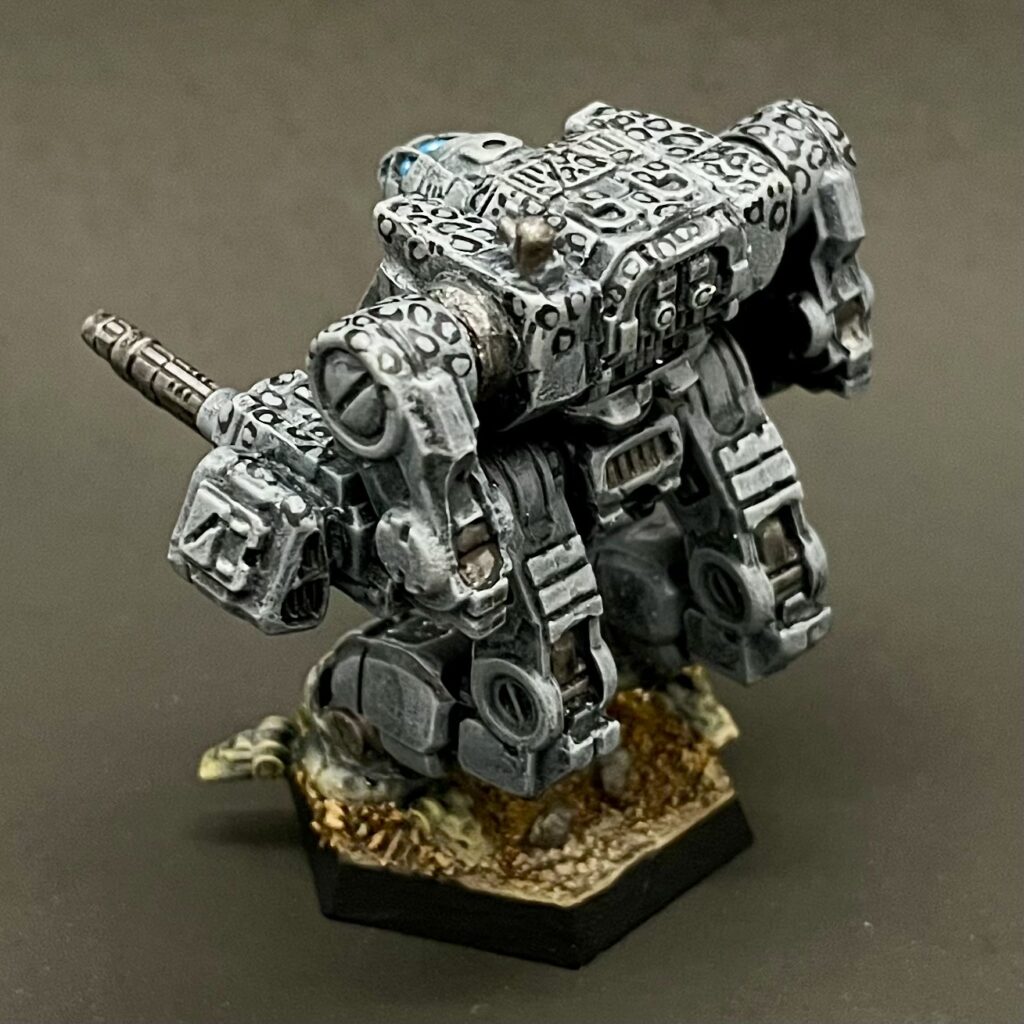 a kitbashed Iron Cheetah miniature painted in grey with white spots ringed in black
