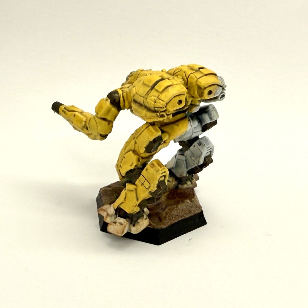 a Falconer miniature painted in yellow and white