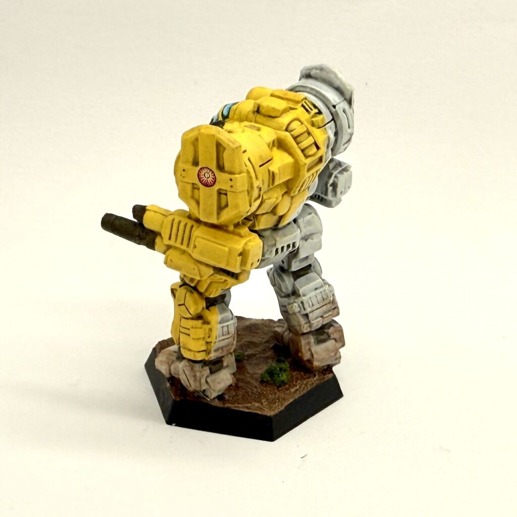 a Templar miniature painted in yellow and white