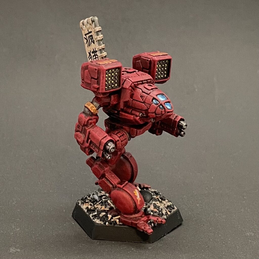 a Timber Wolf miniature painted in red with gold accents and a kitbashed banner