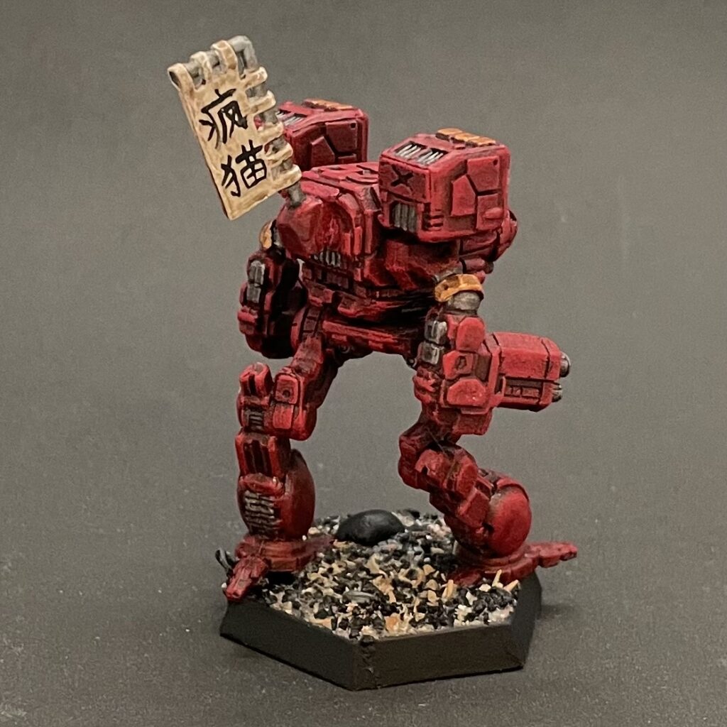 a Timber Wolf miniature painted in red with gold accents and a kitbashed banner