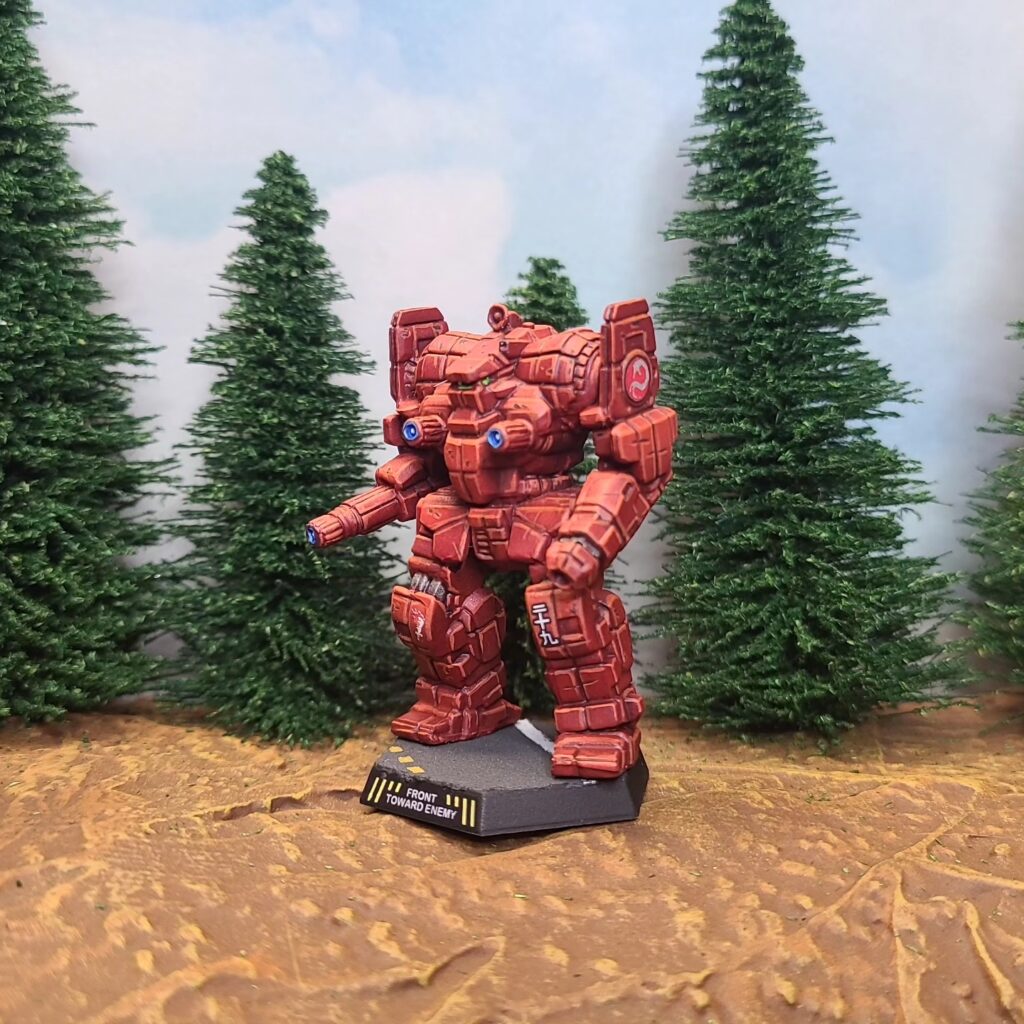 an Awesome miniature painted red with a green cockpit