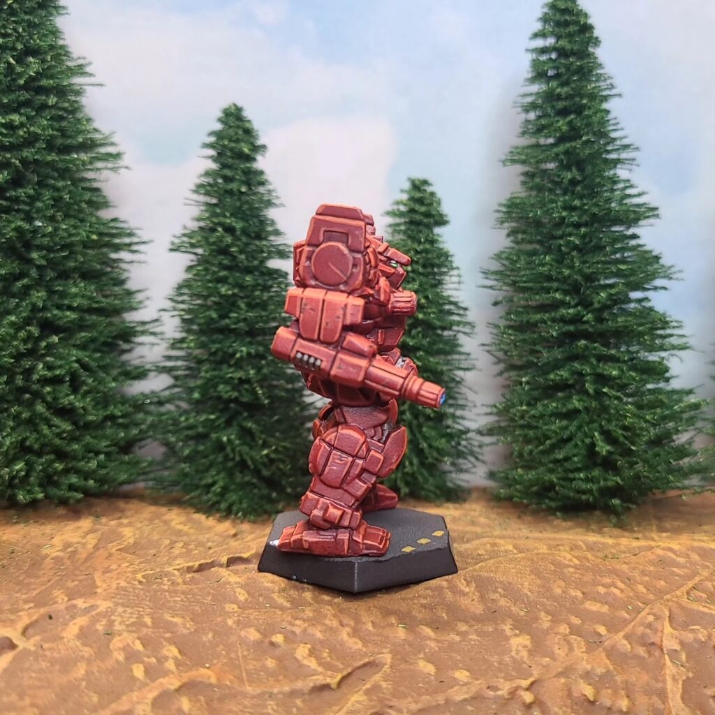 an Awesome miniature painted red with a green cockpit