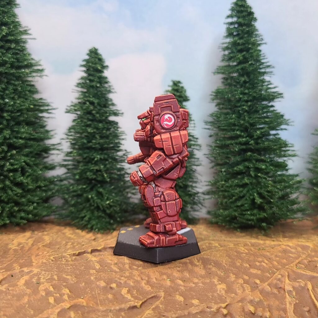 an Awesome miniature painted red with a green cockpit