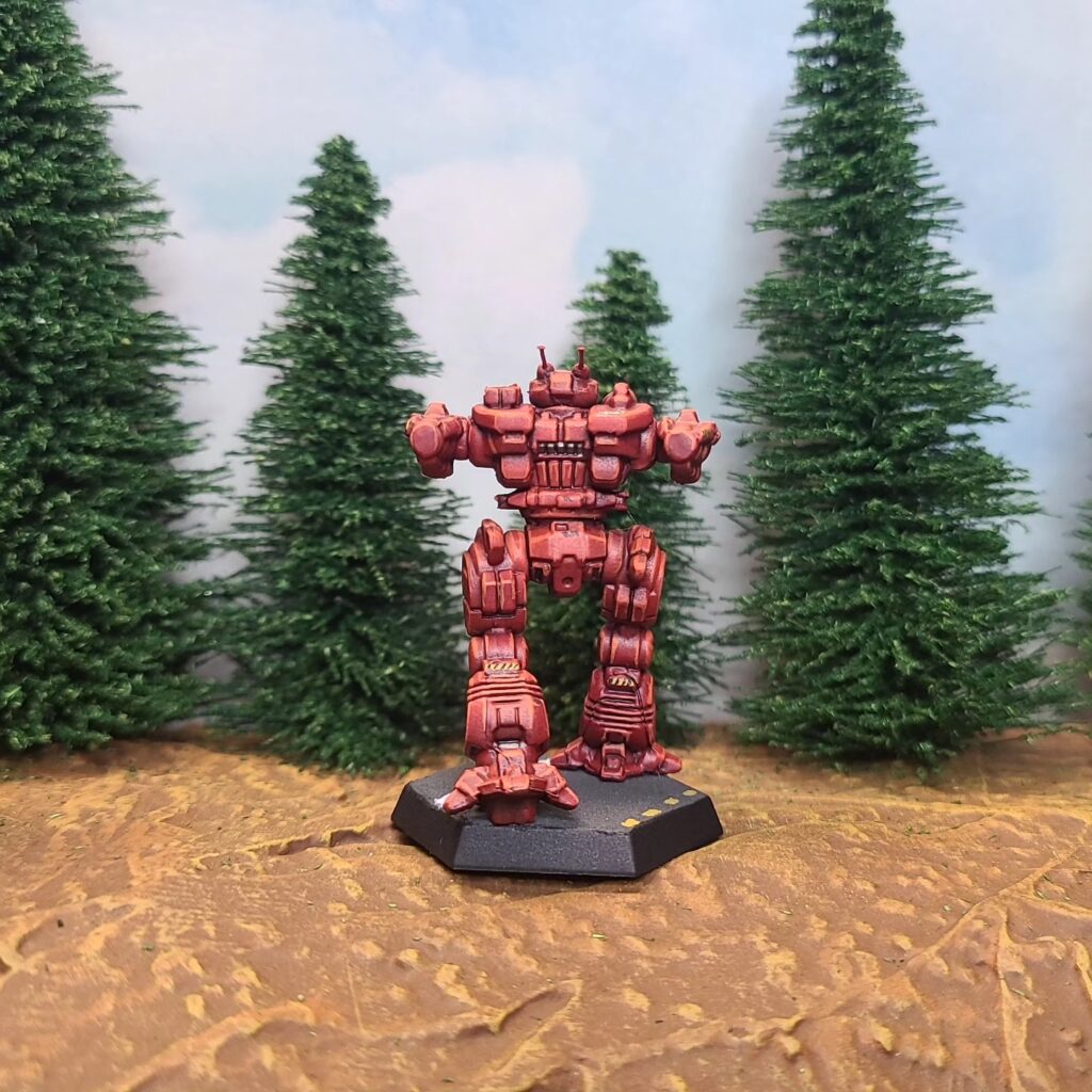 a Lancelot miniature painted red with a green cockpit