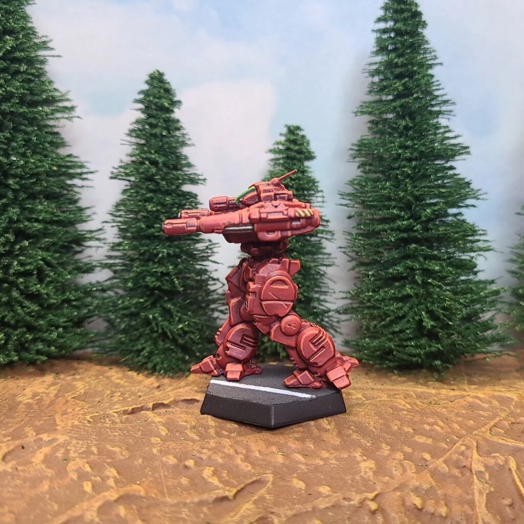 a Lancelot miniature painted red with a green cockpit