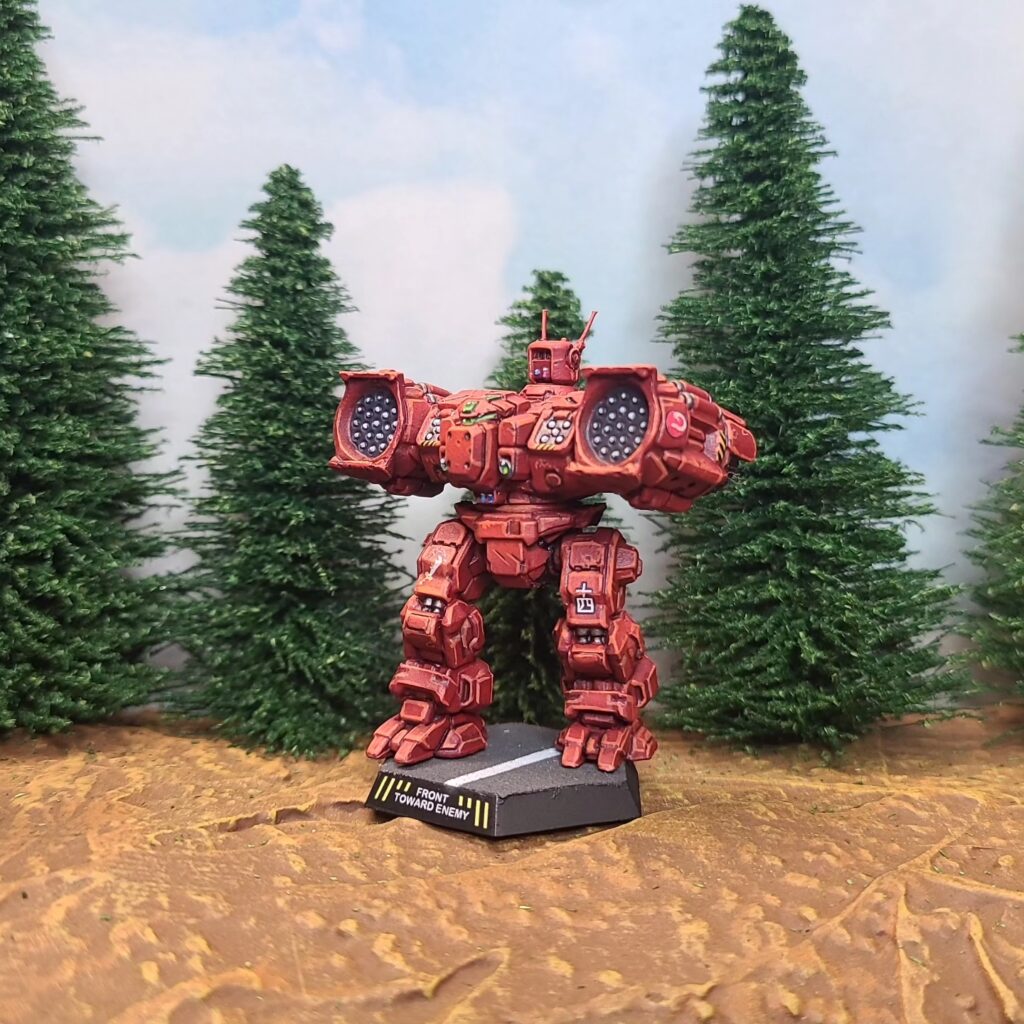 a Longbow miniature painted red with a green cockpit