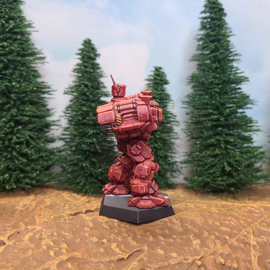 a Longbow miniature painted red with a green cockpit