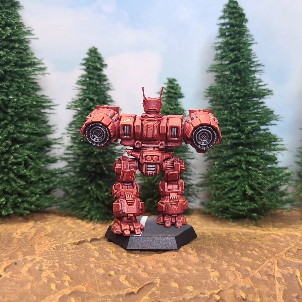 a Longbow miniature painted red with a green cockpit