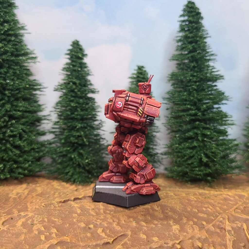 a Longbow miniature painted red with a green cockpit