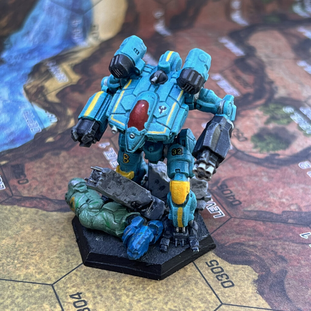 War Crow miniature painted in turquoise with yellow and grey accents