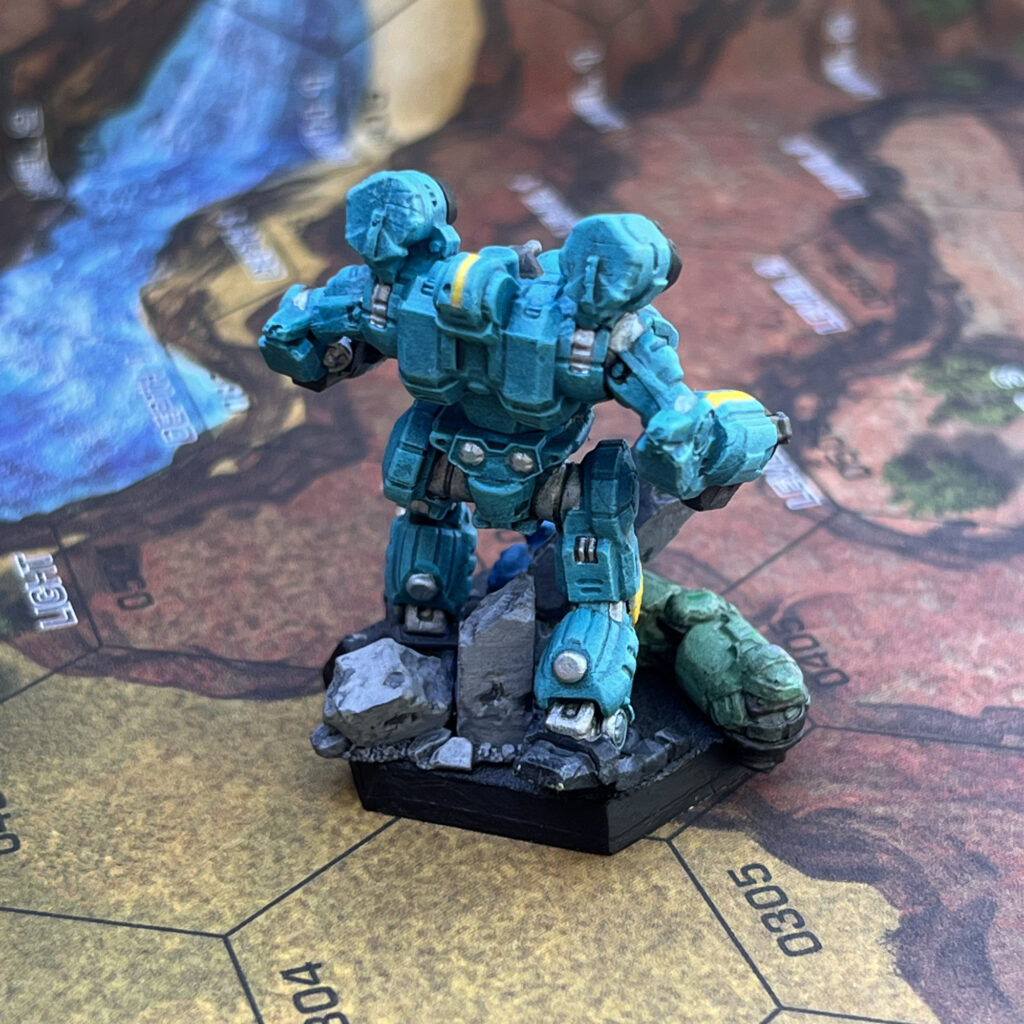 War Crow miniature painted in turquoise with yellow and grey accents