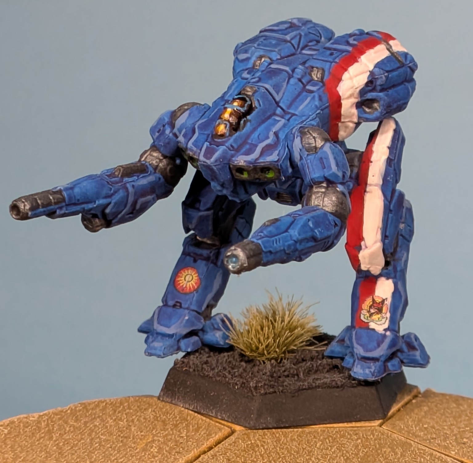 Falconer miniature painted in blue with red & white stripes down the left side