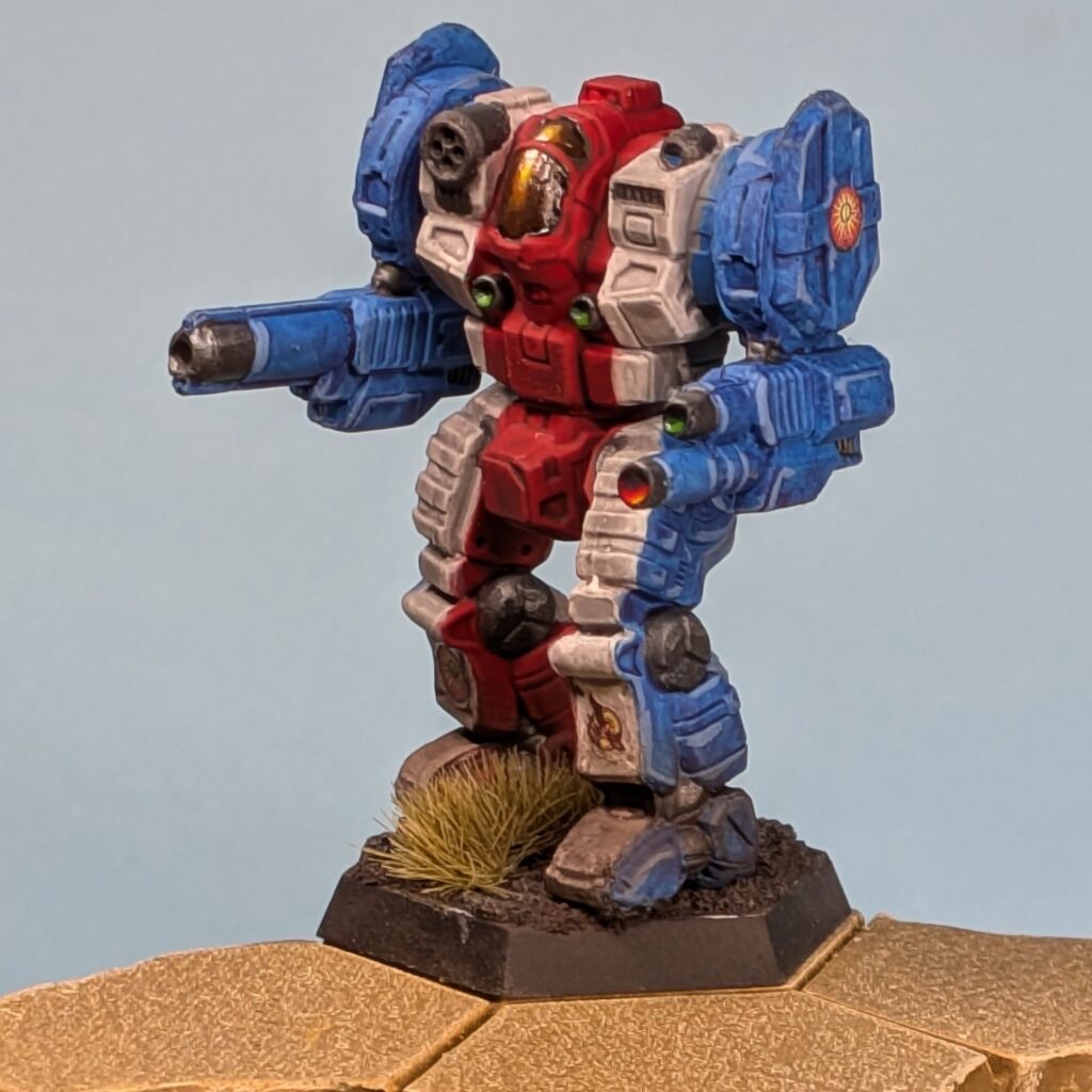 a Templar miniature painted in vertical stripes, blue to white to red in the center