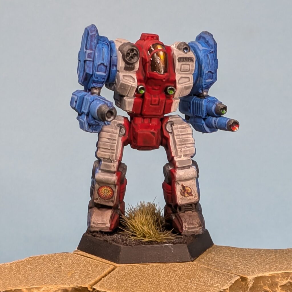 a Templar miniature painted in vertical stripes, blue to white to red in the center