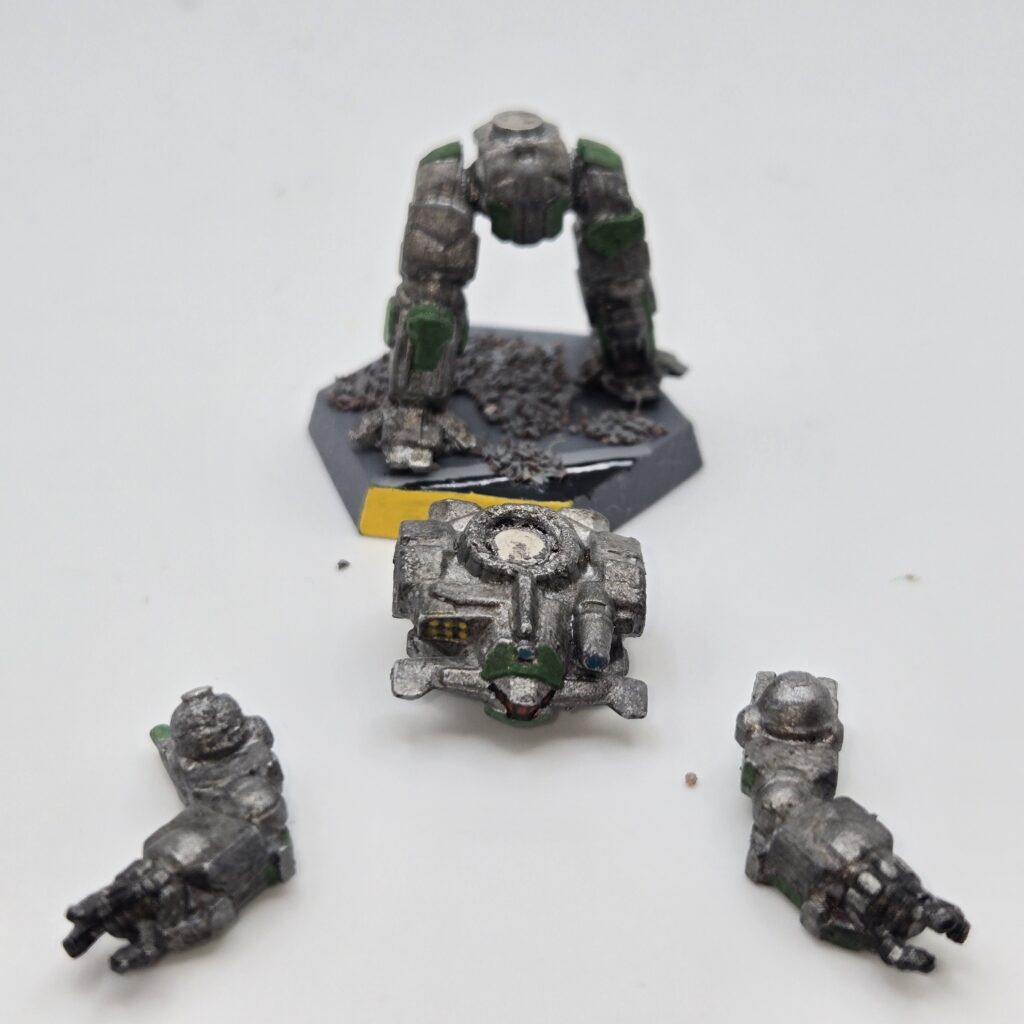 Hammerhead miniature painted metallic grey with green accents. The torso and arms have been magnetized and disassembled