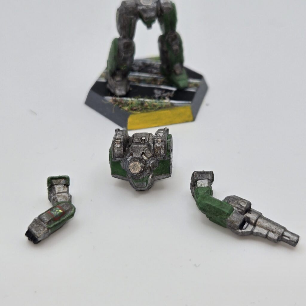 Incubus miniature painted metallic grey with green accents. The torso and arms have been magnetized and disassembled