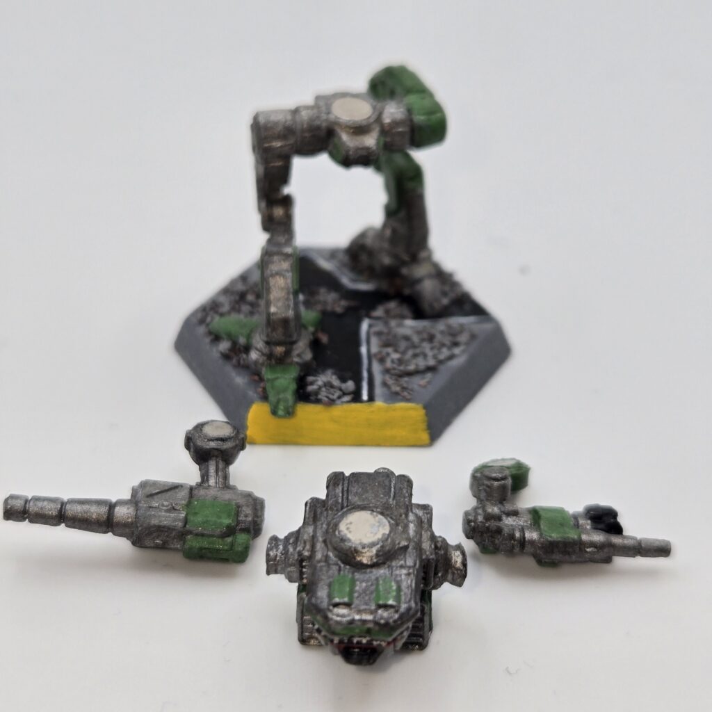 Kit Fox miniature painted metallic grey with green accents. The torso and arms have been magnetized and disassembled