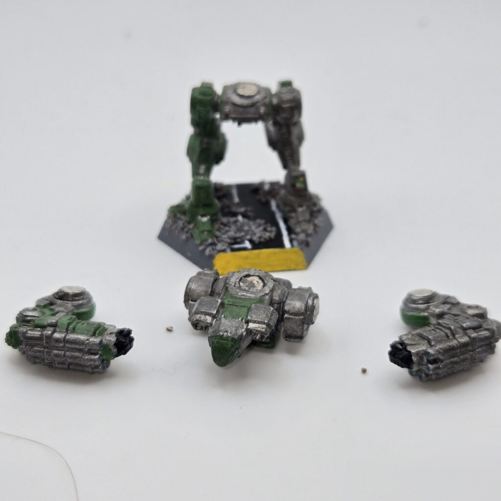 Nova miniature painted metallic grey with green accents. The torso and arms have been magnetized and disassembled