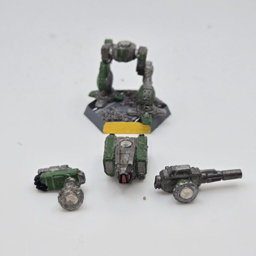 Shadow Cat miniature painted metallic grey with green accents. The torso and arms have been magnetized and disassembled