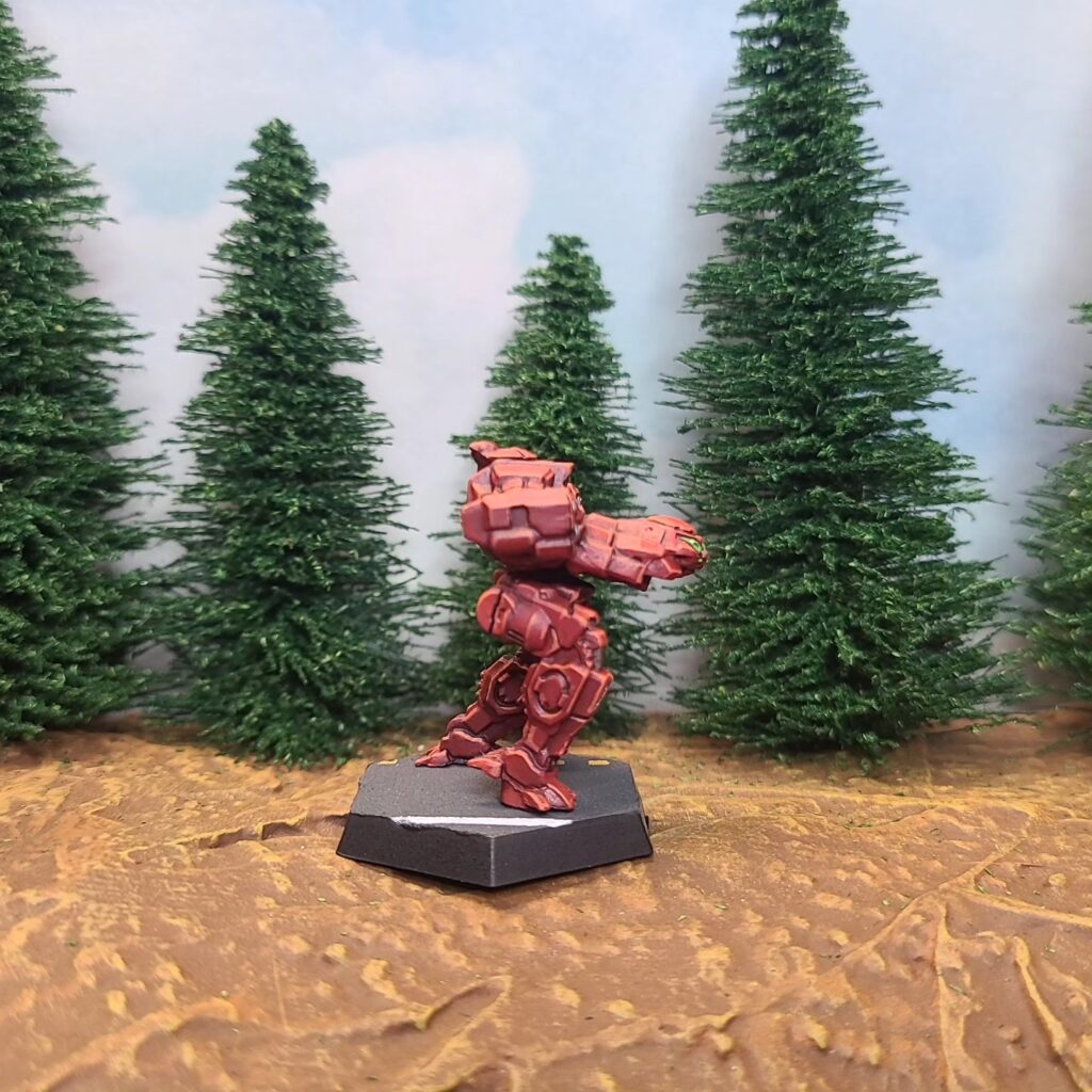a Jenner miniature painted red with green cockpit accents