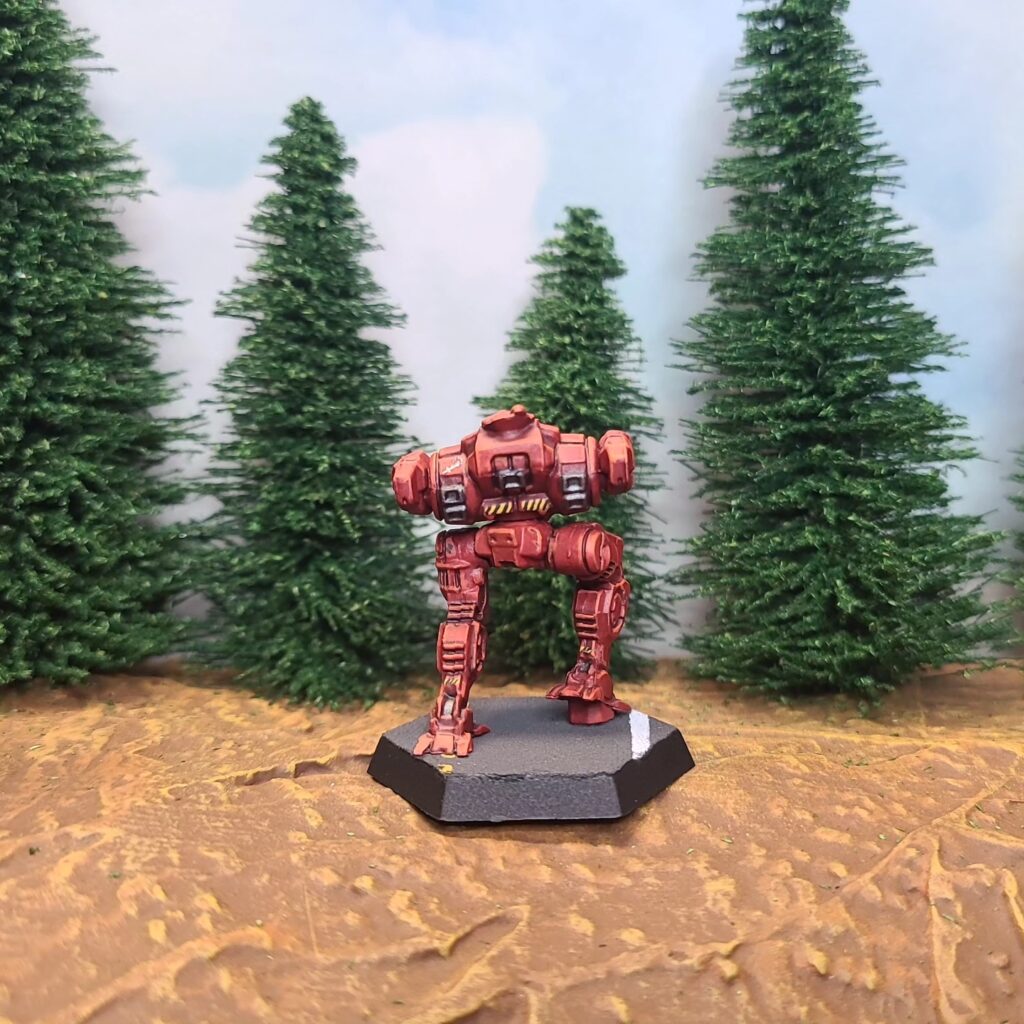 a Jenner miniature painted red with green cockpit accents