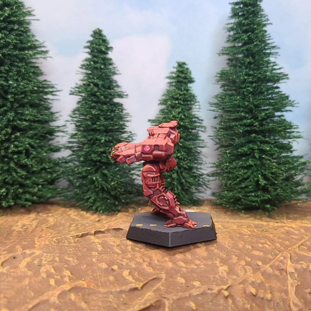 a Jenner miniature painted red with green cockpit accents