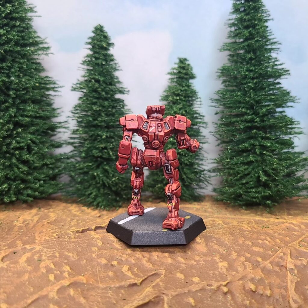 a Panther miniature painted red with green cockpit accents