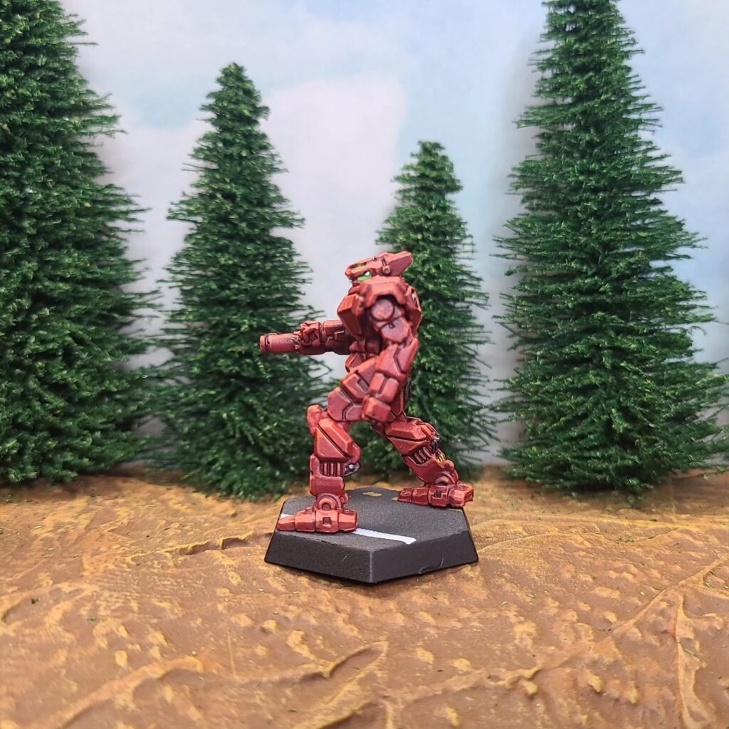 a Panther miniature painted red with green cockpit accents