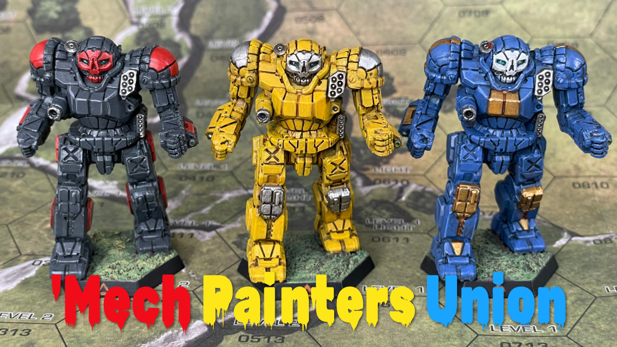 Three Atlas miniatures painted red and grey, yellow, and blue
