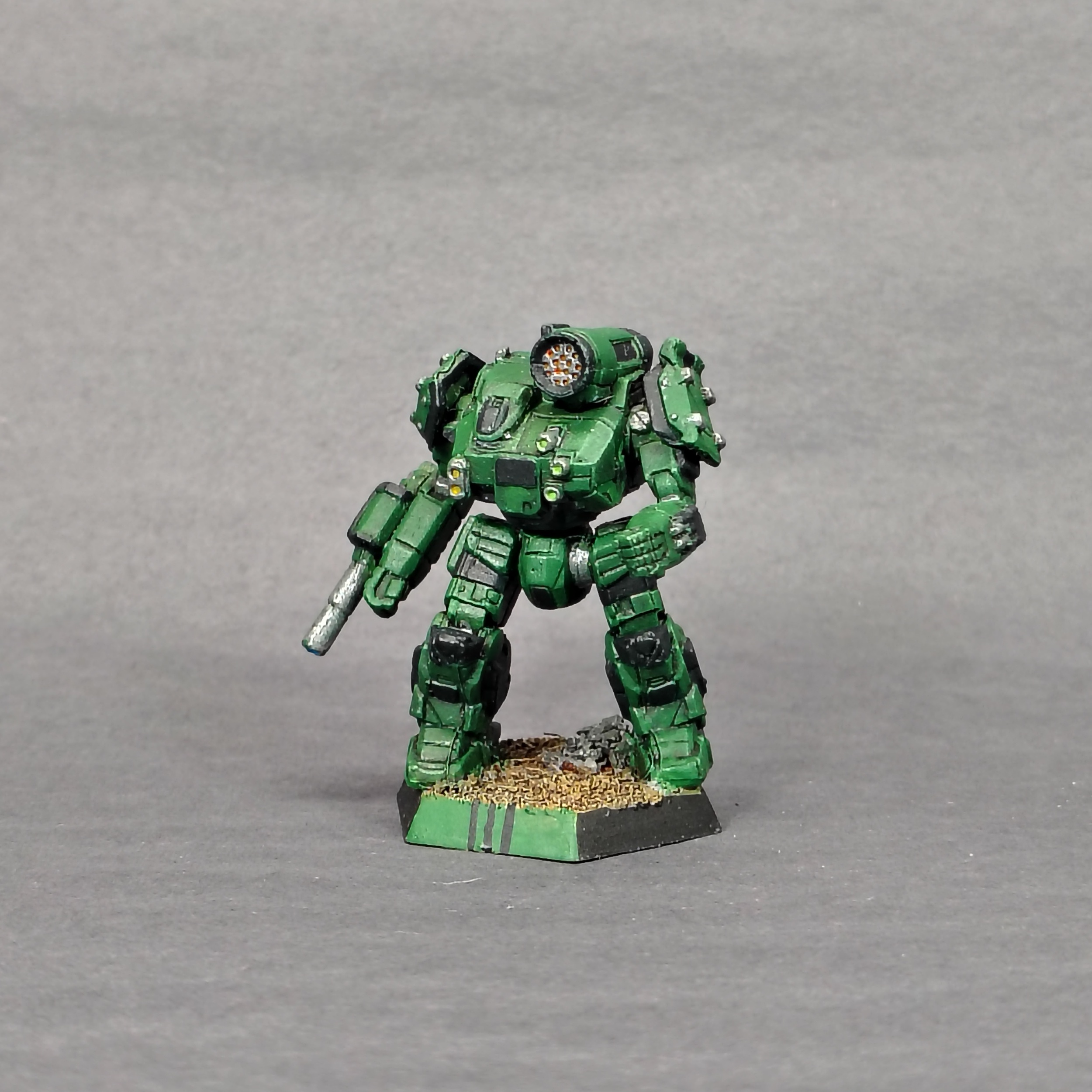 a Thunderbolt miniature painted green with black accents