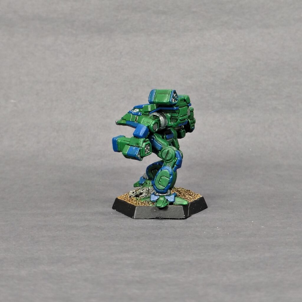 a Bushwacker miniature painted green with blue accents