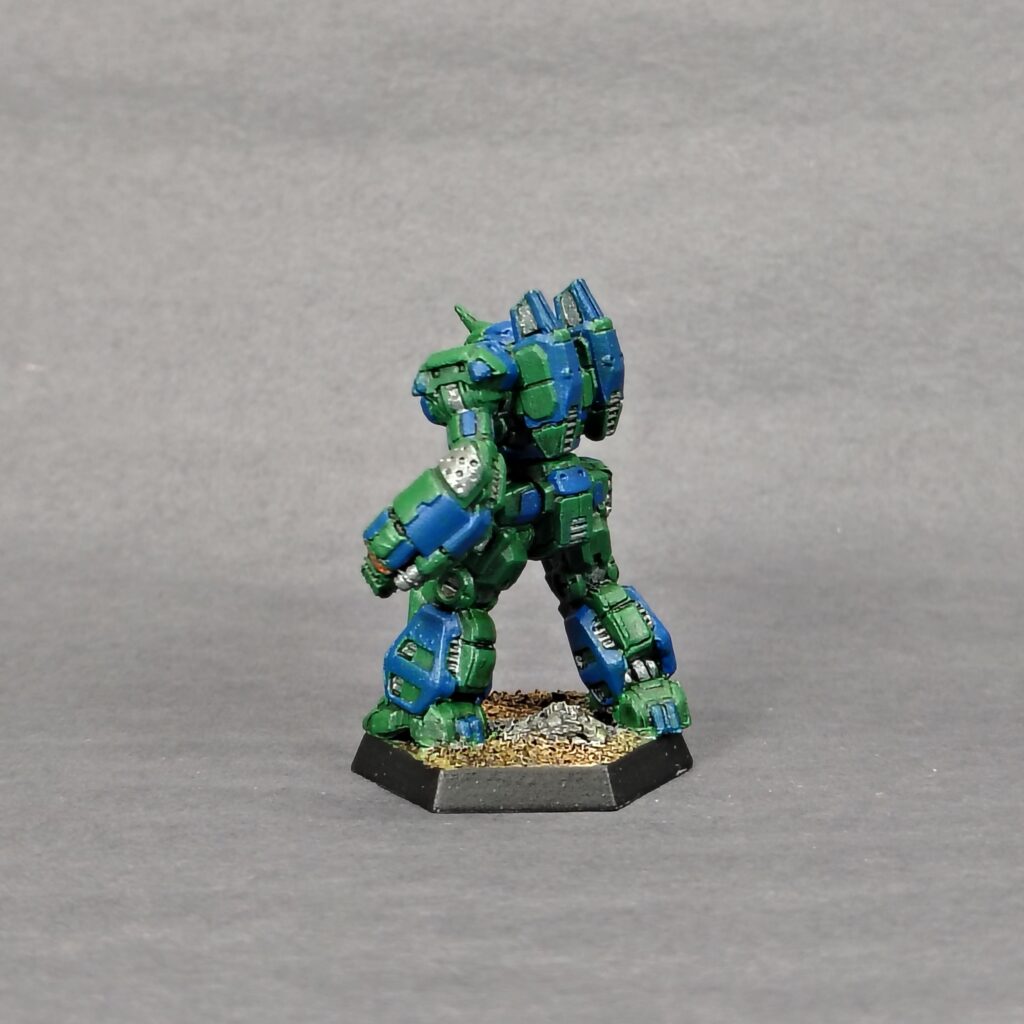 a Crusader miniature painted green with blue accents