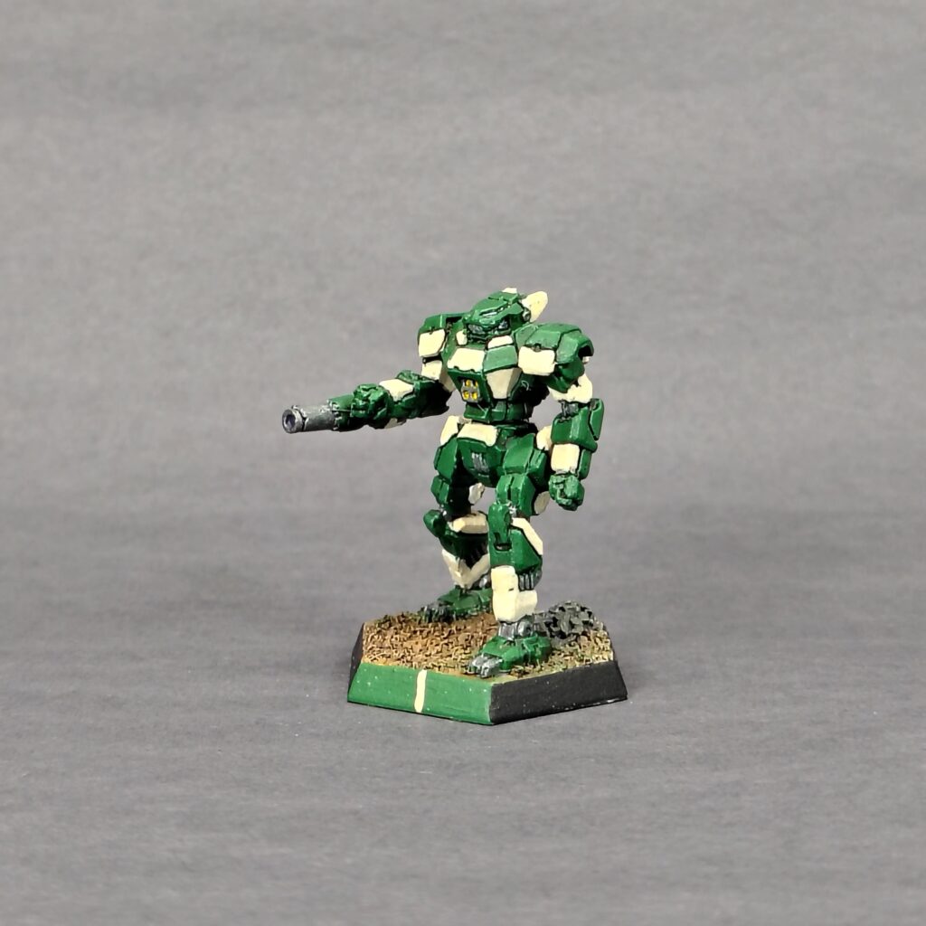 a Panther miniature painted green with ivory accents