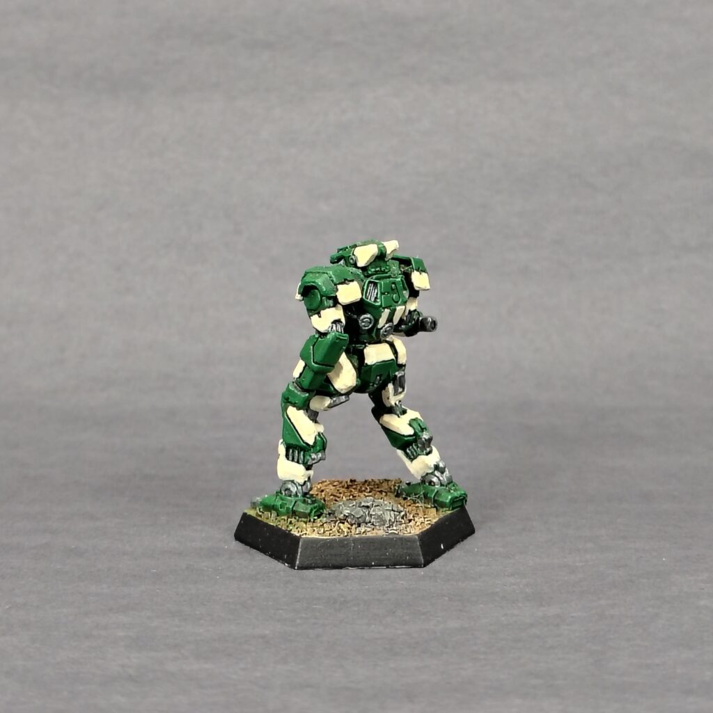 a Panther miniature painted green with ivory accents