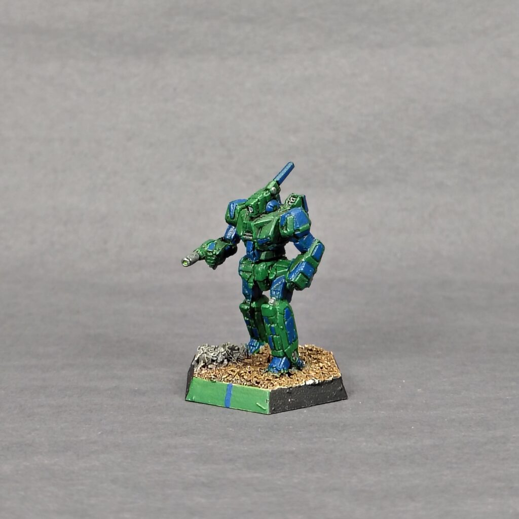 a Stinger miniature painted green with blue accents
